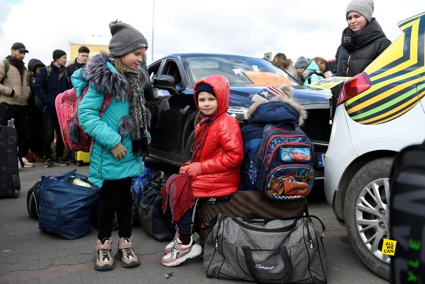 Refugees walk across the border to safety in Przemysl, Poland.