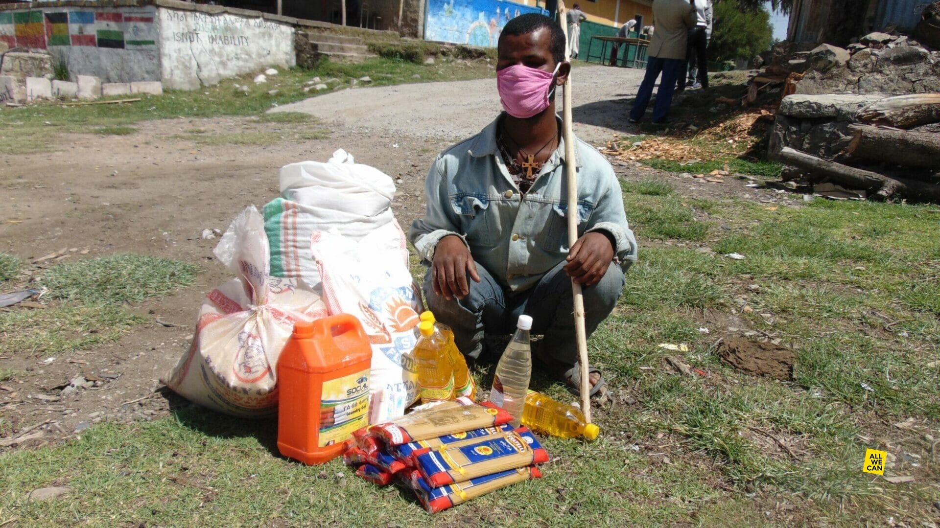 Biruk, a disabled student in Ethiopia, receives emergency food supplies.